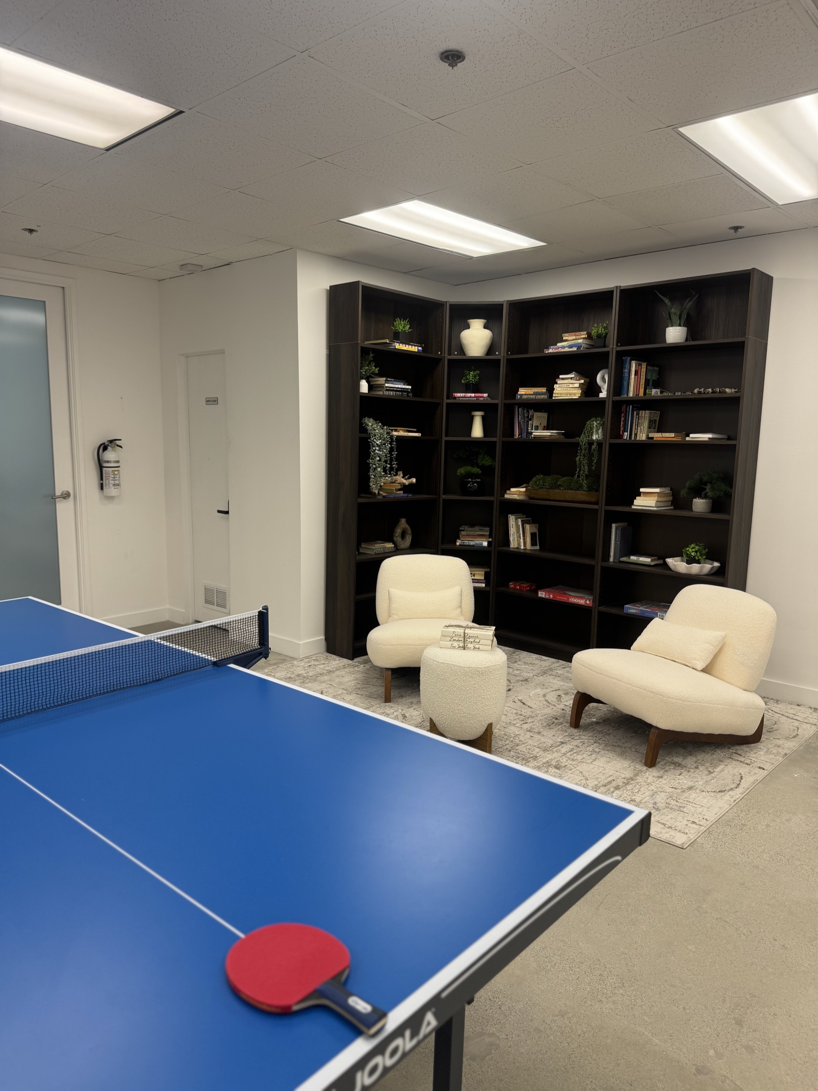 Game room with full-size ping pong table and lounge seating