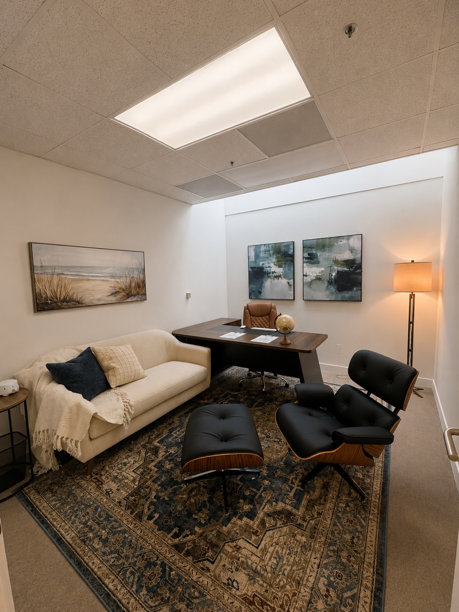 Private one-on-one therapy office with leather lounge chair and sofa