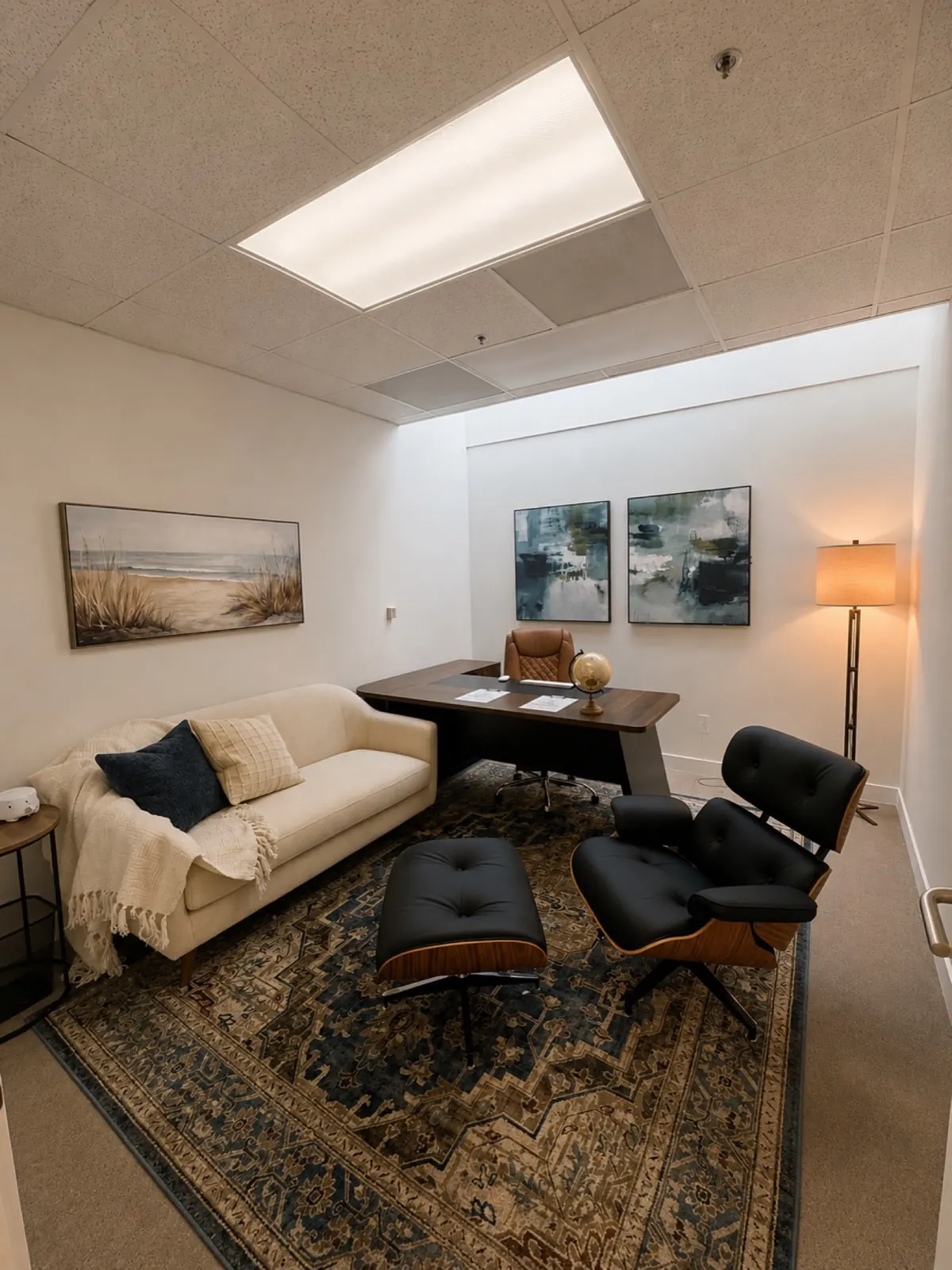 Private one-on-one therapy office with leather lounge chair and sofa
